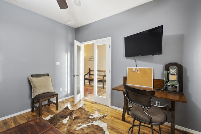 office space with hardwood / wood-style flooring, french doors, and ceiling fan