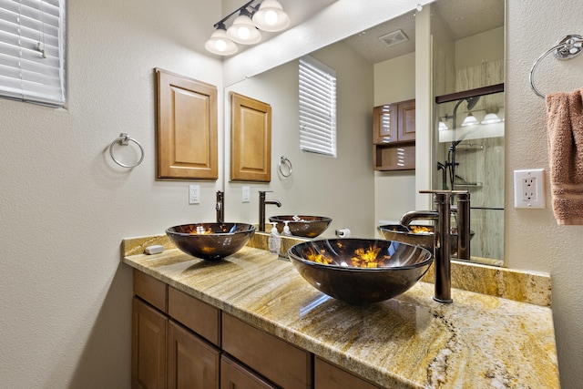 bathroom with vanity and walk in shower