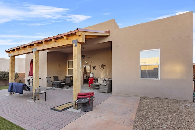 rear view of house featuring a patio area, outdoor lounge area, and ceiling fan