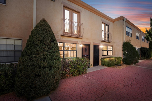 view of outdoor building at dusk