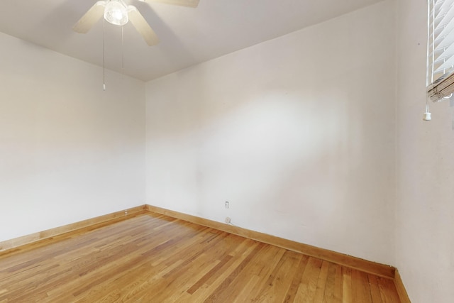 empty room featuring hardwood / wood-style flooring and ceiling fan