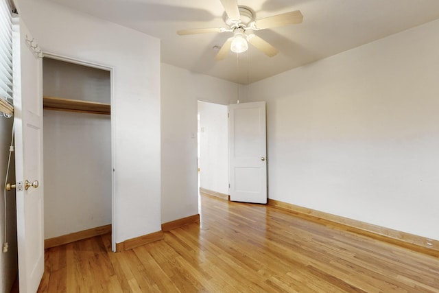 unfurnished bedroom featuring light hardwood / wood-style floors, a closet, and ceiling fan