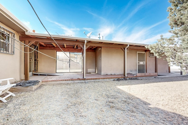 rear view of house with a patio