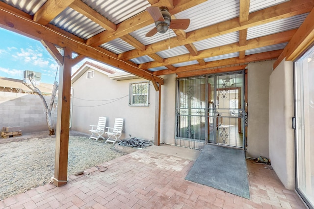 exterior space featuring ceiling fan