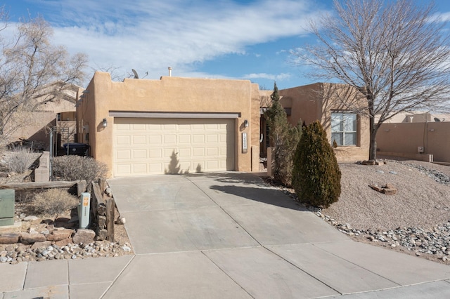 adobe home featuring a garage