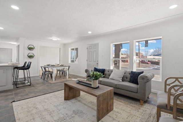 living room with a textured ceiling