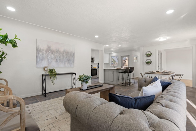 living room featuring a textured ceiling