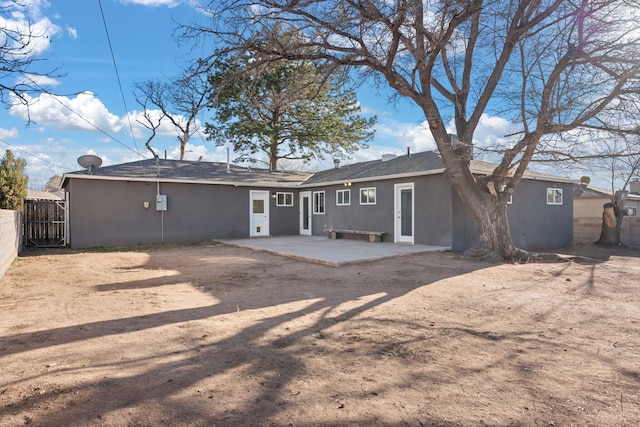 rear view of property featuring a patio