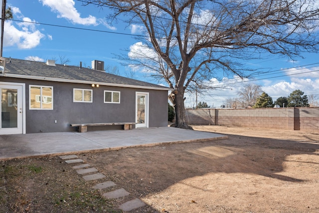 back of property featuring a patio area