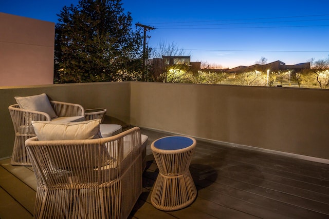 view of balcony at dusk