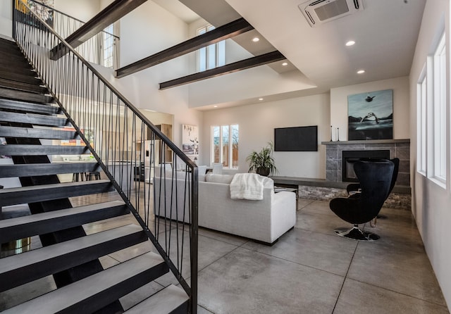 living room with a towering ceiling