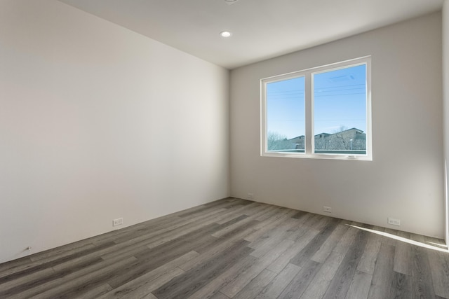 unfurnished room featuring hardwood / wood-style floors