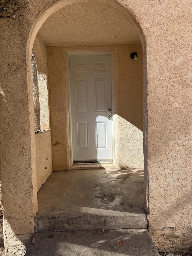 corridor with arched walkways