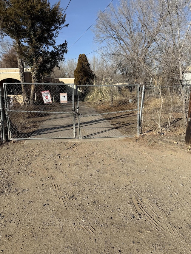 view of gate featuring fence