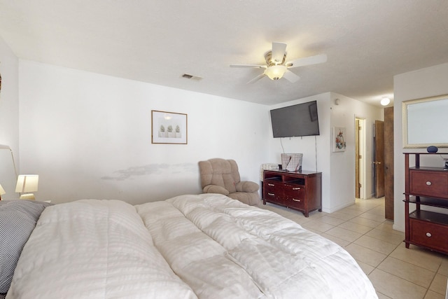 tiled bedroom with ceiling fan