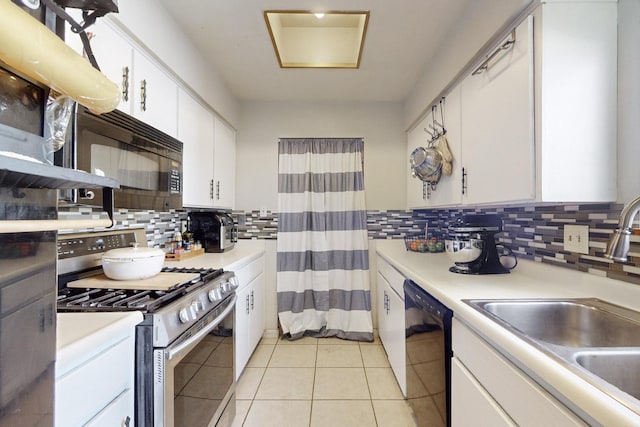 kitchen featuring white cabinetry, sink, backsplash, and black appliances