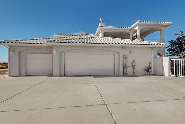 mediterranean / spanish house with a garage