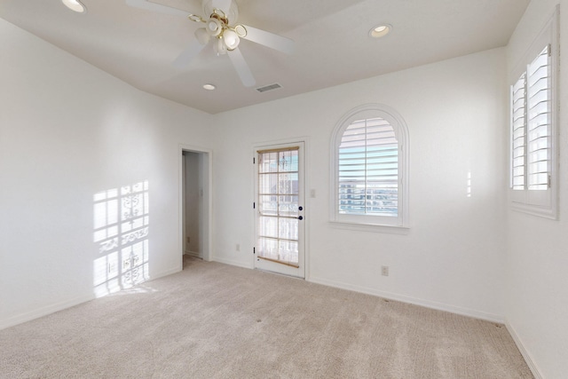 carpeted empty room with ceiling fan