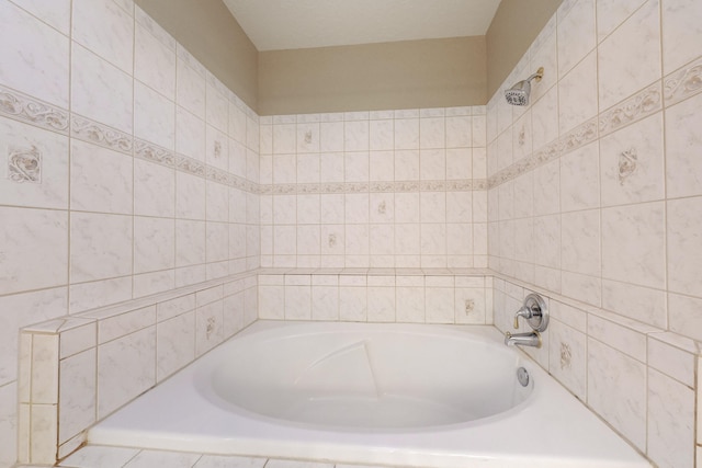 bathroom featuring tiled tub