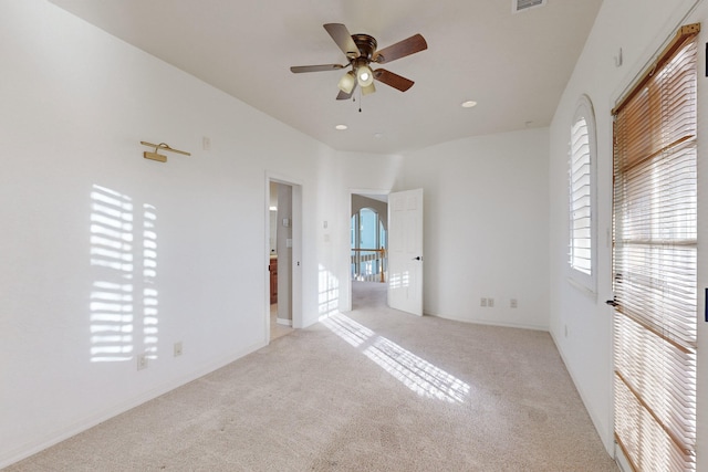 unfurnished bedroom with ceiling fan and light carpet