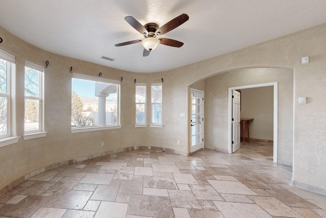 empty room featuring ceiling fan