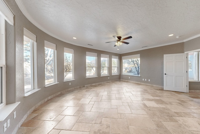 spare room featuring ceiling fan, ornamental molding, and a textured ceiling