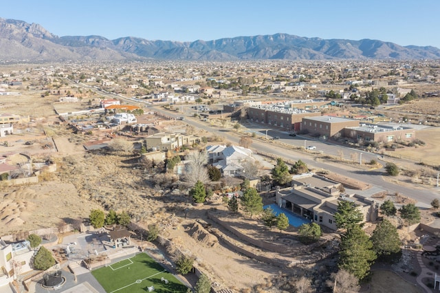 birds eye view of property featuring a mountain view