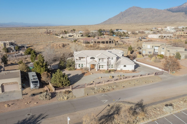 birds eye view of property with a mountain view