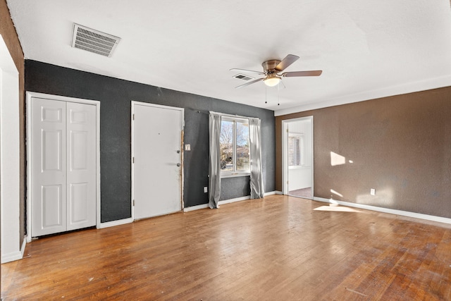 interior space with hardwood / wood-style flooring and ceiling fan