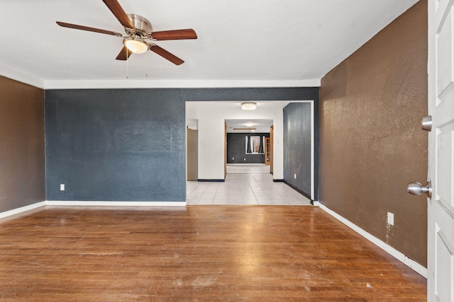 unfurnished living room with ceiling fan and light hardwood / wood-style floors