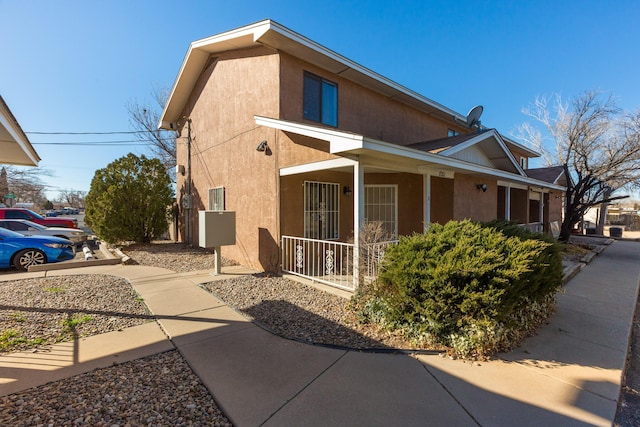 view of property exterior with a porch