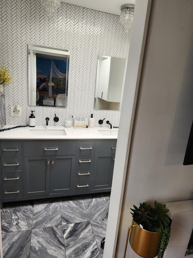 7535 Quemado Ct NE, Albuquerque, NM 87109 - bathroom featuring double vanity, backsplash, and a sink
