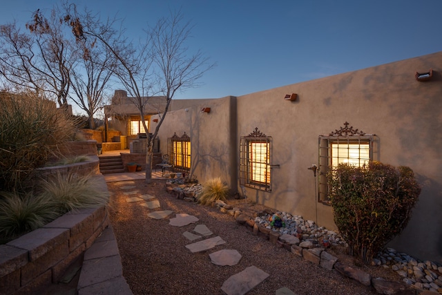 view of property exterior at dusk