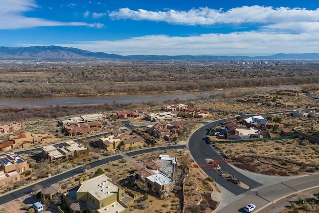 aerial view featuring a water and mountain view