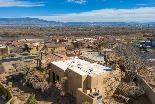 drone / aerial view featuring a mountain view