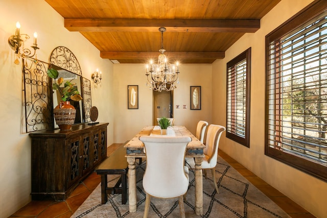 tiled dining area featuring beamed ceiling, wood ceiling, and a chandelier