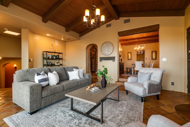 tiled living room with vaulted ceiling with beams, wood ceiling, and a chandelier