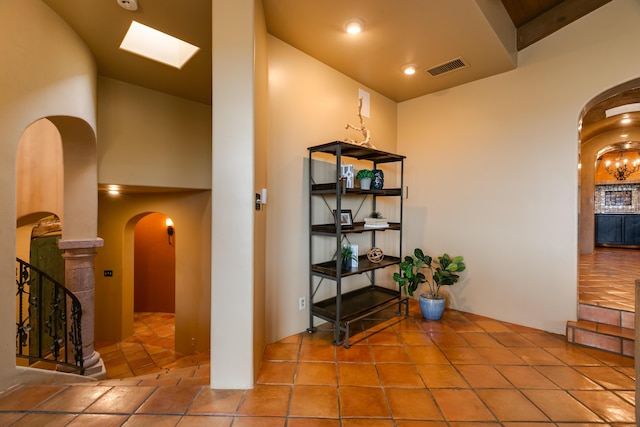 corridor with tile patterned flooring