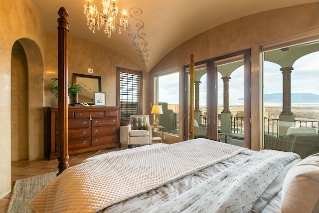 tiled bedroom with a water view, lofted ceiling, access to exterior, and an inviting chandelier