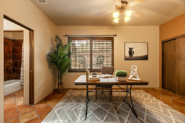 office with ceiling fan and tile patterned flooring