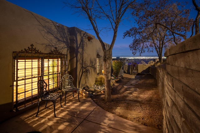 view of patio terrace at dusk