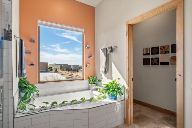 doorway to outside with light tile patterned floors