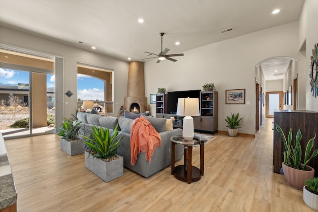 living room featuring ceiling fan and light hardwood / wood-style floors