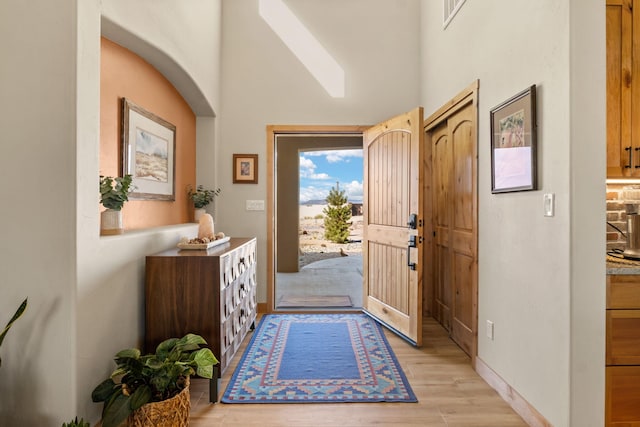 foyer with light wood-type flooring