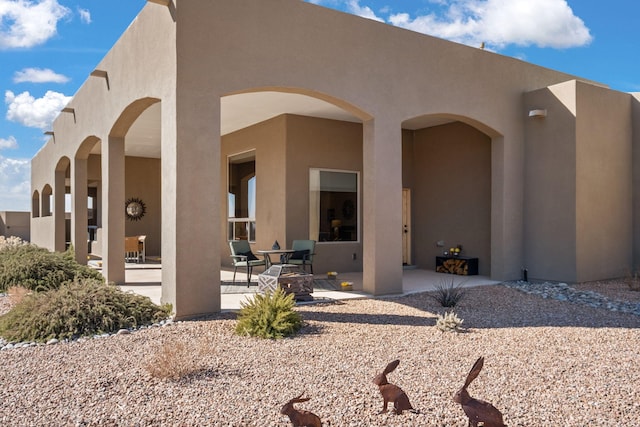 rear view of house with a patio area