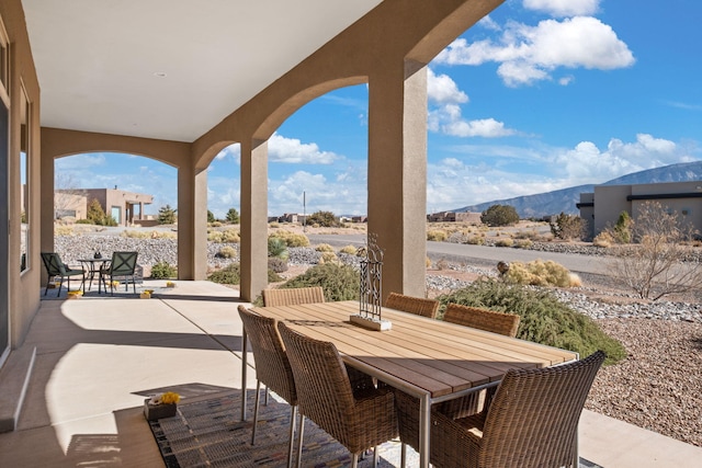 view of patio / terrace with a mountain view