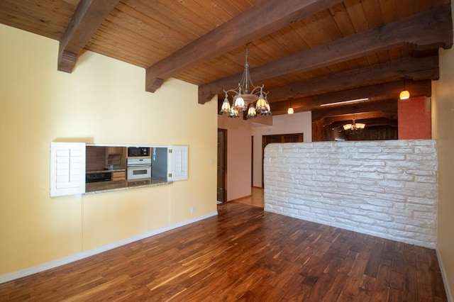 unfurnished living room featuring beam ceiling, dark wood-style flooring, wood ceiling, and an inviting chandelier