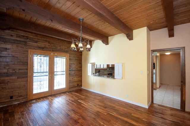 interior space with french doors, wooden ceiling, wood finished floors, and a notable chandelier