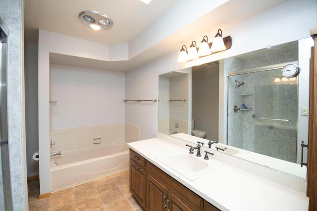 bathroom with a bath, vanity, toilet, and a shower stall