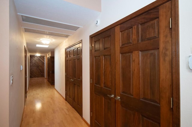 hallway with light wood finished floors